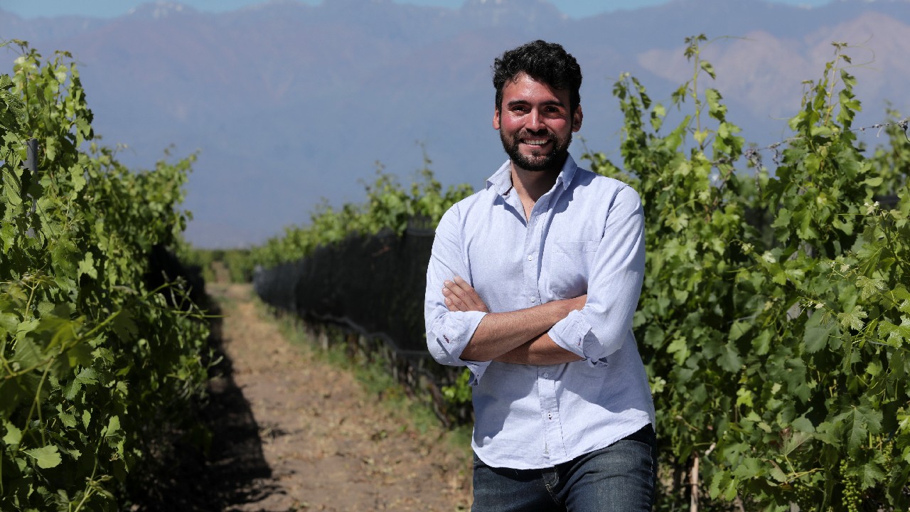 Winemaker in Domaine Bousquet’s vineyard stands happily ready to dispel boxed wine myths.