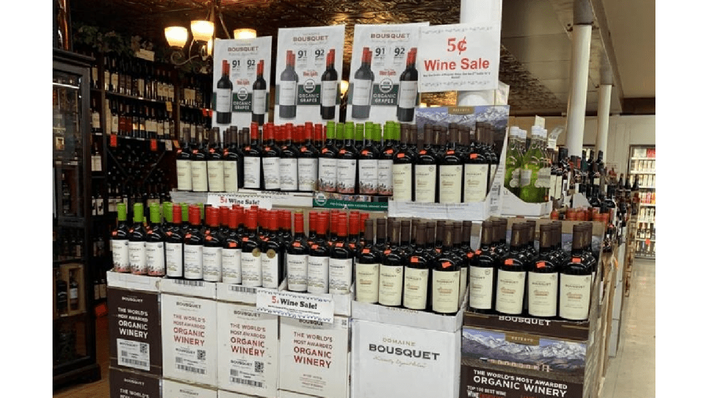 A display case of Domaine Bousquet organic wine at a grocery store