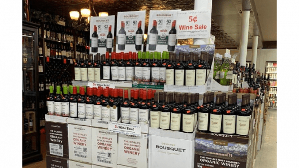 A display case of Domaine Bousquet organic wine at a grocery store
